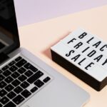 Traveler comparing flight prices on a laptop in a cozy home, exploring tips for finding cheap flights online