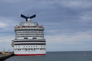 A happy family enjoying activities on a Carnival Cruise ship, perfect for a cruise travel guide for beginners