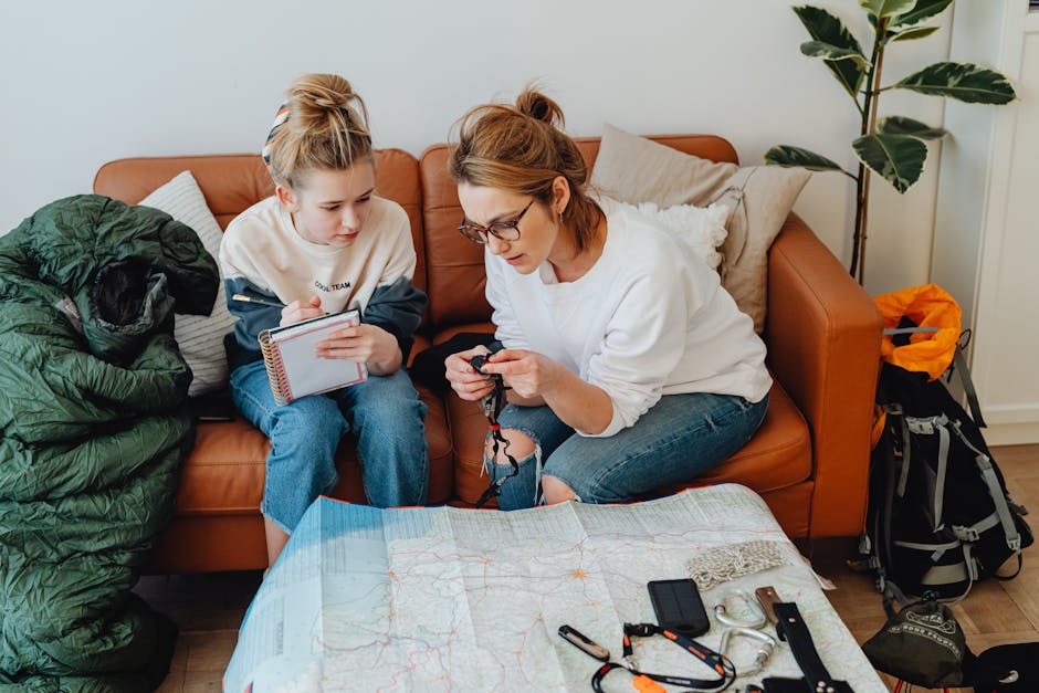 Parents planning a family trip at home with travel brochures and budget tools, exploring top vacation spots for families on a budget